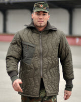 Sous-veste Mil-Tec Bundeswehr ouatée en polyamide avec glissière deux sens et col montant