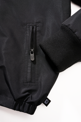 Coupe-vent enfant Brandit Frontzip doublure polaire capuche et trois poches fermées